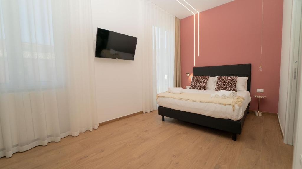 Postel nebo postele na pokoji v ubytování Manere Suites
