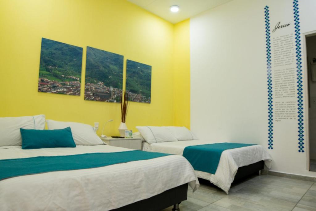 Postel nebo postele na pokoji v ubytování Almaviva Casa Hotel