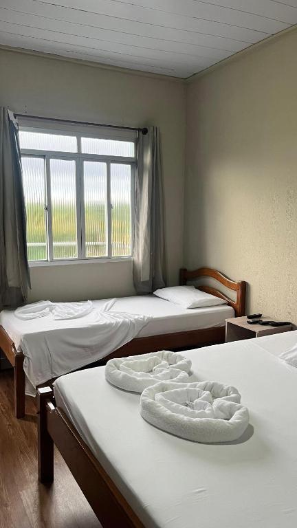 Postel nebo postele na pokoji v ubytování ECO CHALÉ PARK CACHOEIRAS