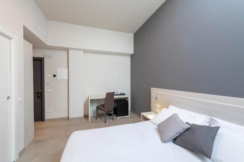Postel nebo postele na pokoji v ubytování Hotel Vecchio Casello