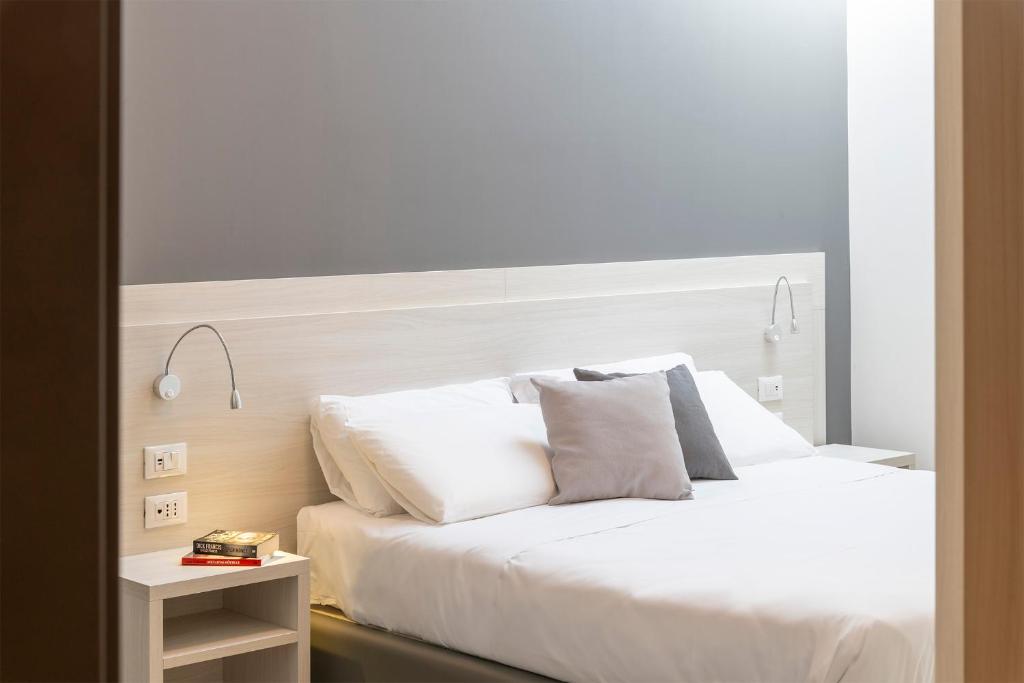 Postel nebo postele na pokoji v ubytování Hotel Vecchio Casello