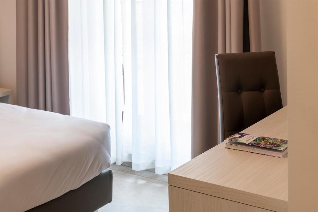 Postel nebo postele na pokoji v ubytování Hotel Vecchio Casello