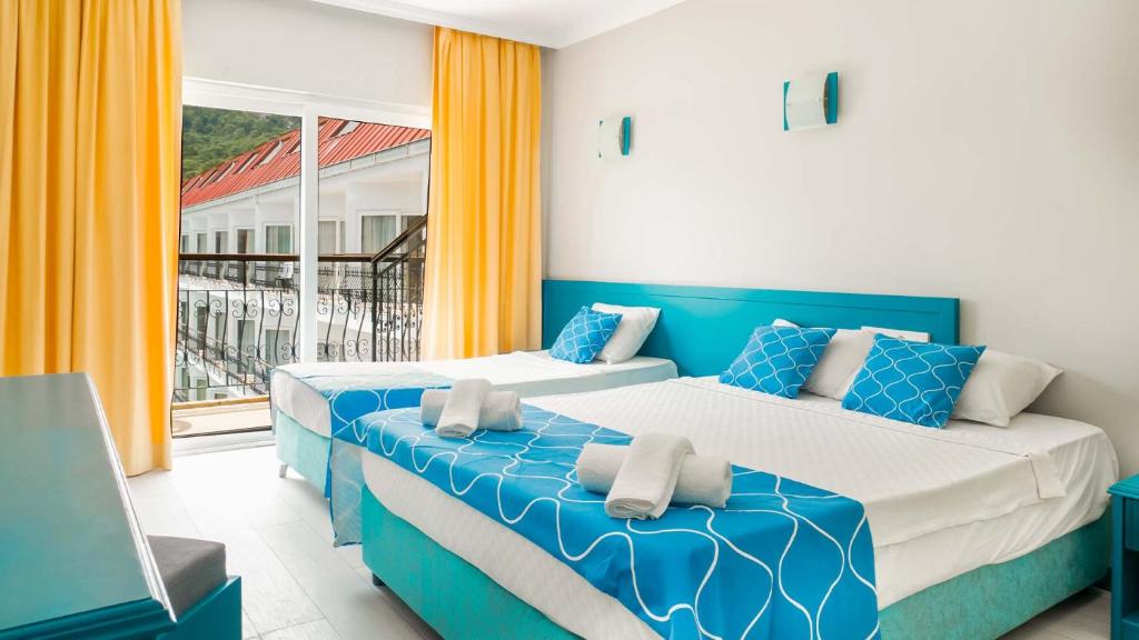 Postel nebo postele na pokoji v ubytování Get Enjoy Hotels