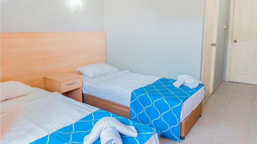 Postel nebo postele na pokoji v ubytování Get Enjoy Hotels