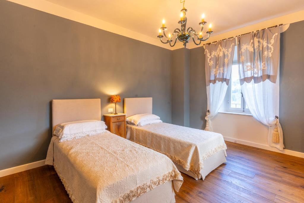 Postel nebo postele na pokoji v ubytování La Rocca di Camporgiano