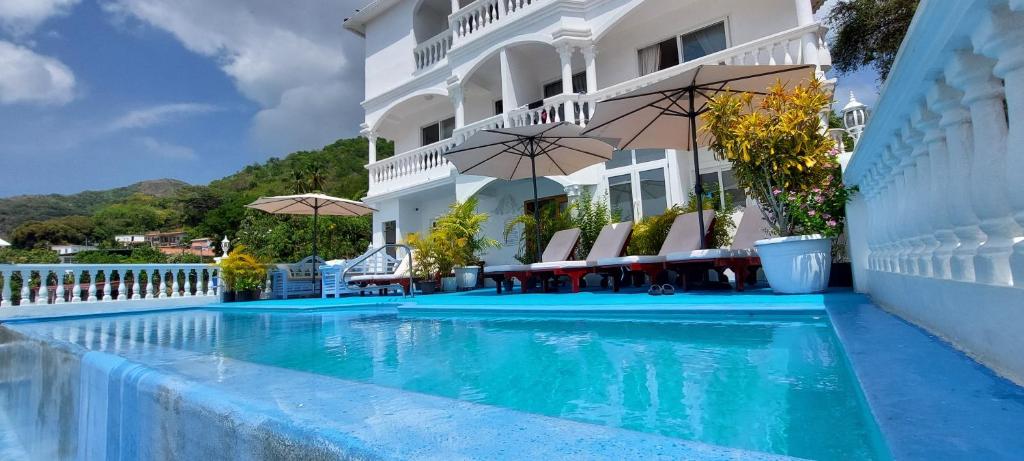 a swimming pool in front of a hotel at Taboga Palace SPA Hotel in Taboga