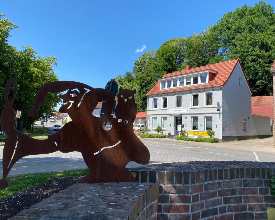 a statue of a horse on the side of a street at SeidenStrasse Pension in Mölln