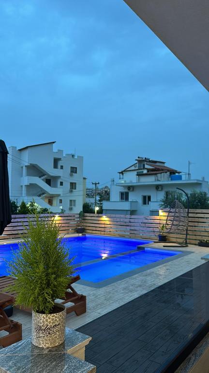 a view of a swimming pool at night at Noa Boutique Hotel in Ksamil