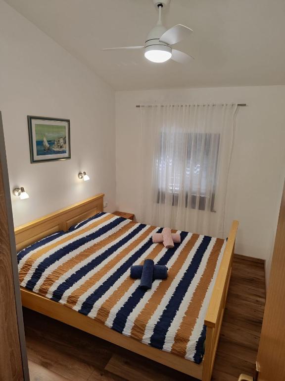 Postel nebo postele na pokoji v ubytování Apartments Nagj