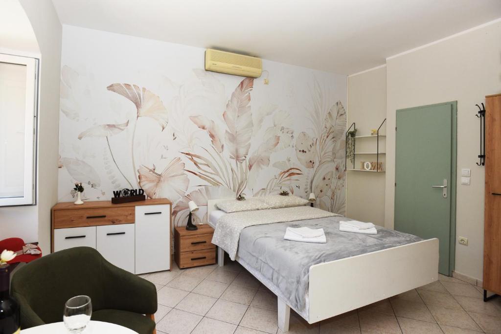 Postel nebo postele na pokoji v ubytování Apartmani Zukic