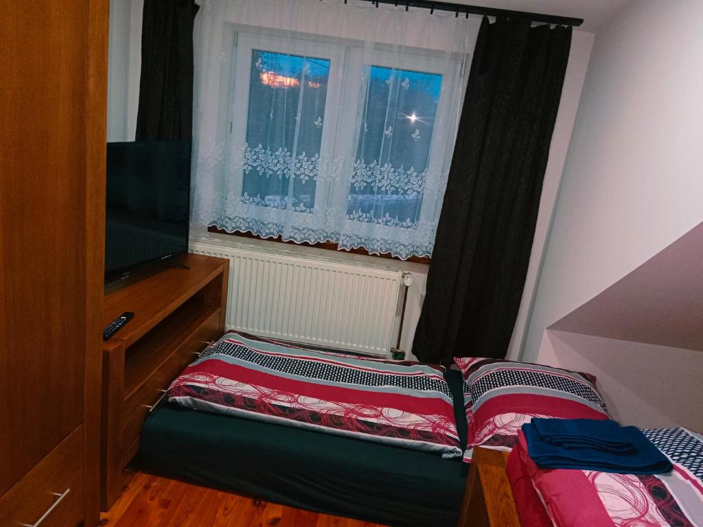 Postel nebo postele na pokoji v ubytování Penzion Václav