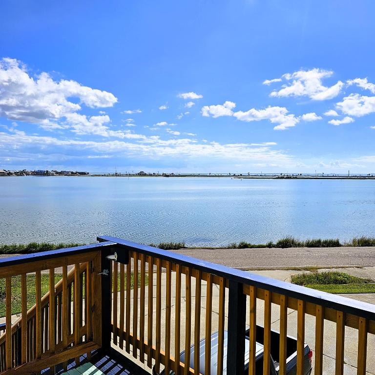 a deck with a view of a large body of water at Pat's Perch in Rockport