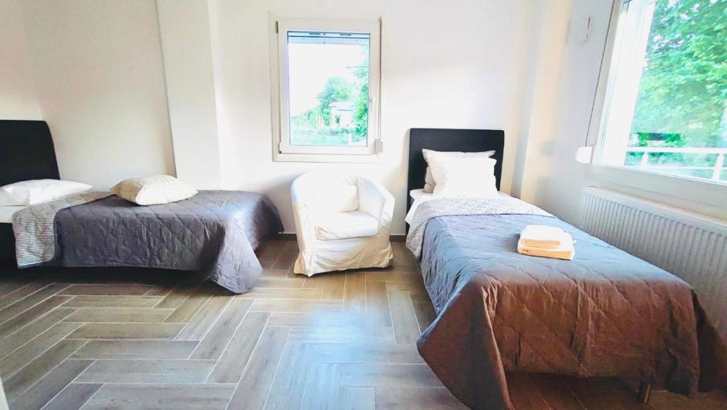 Postel nebo postele na pokoji v ubytování Anesi Suites & Rooms