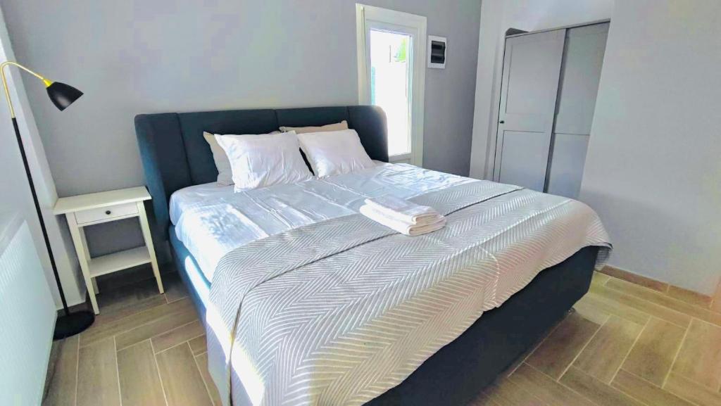 Postel nebo postele na pokoji v ubytování Anesi Suites & Rooms