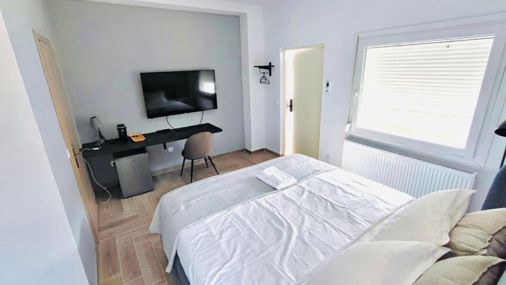 Postel nebo postele na pokoji v ubytování Anesi Suites & Rooms