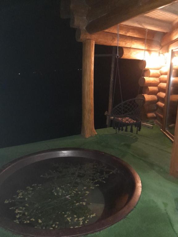 a bath tub in a room with a table at Villa Filiak in Yablunytsya