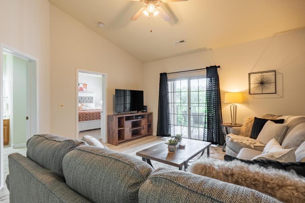 a living room with two couches and a table at Golf View - Elevator Accessible - Center Of Branson - FREE TICKETS INCLUDED - RL8-11A in Branson