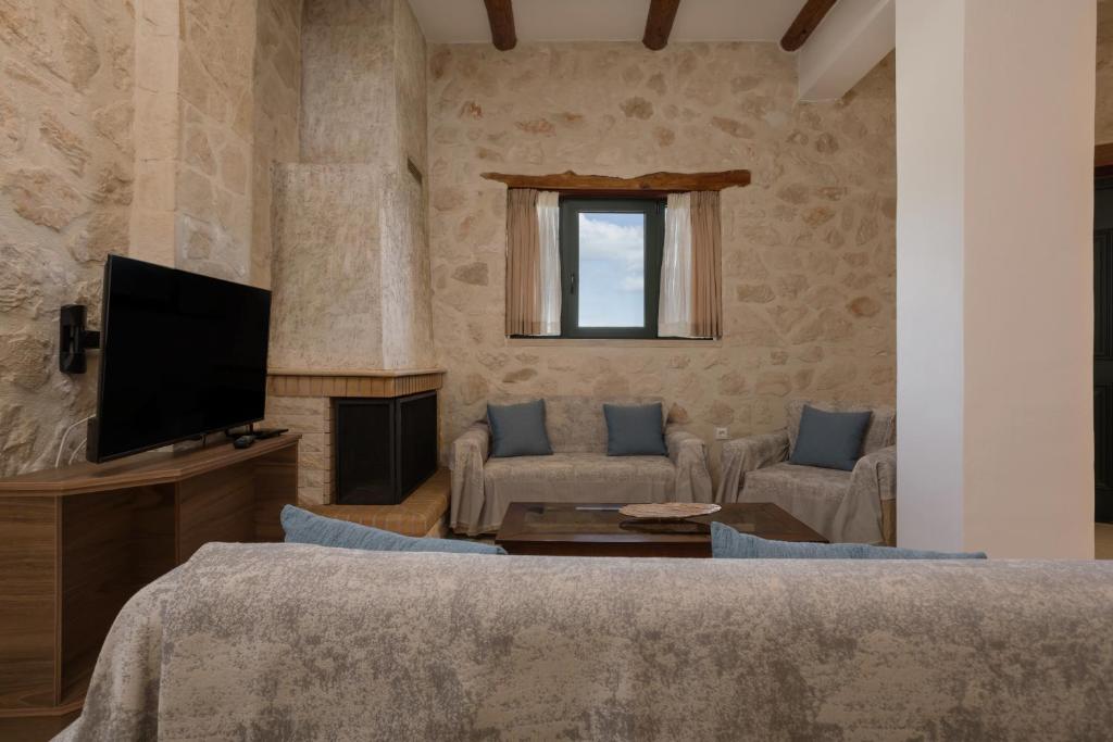 TV a/nebo společenská místnost v ubytování DANDELION stone house