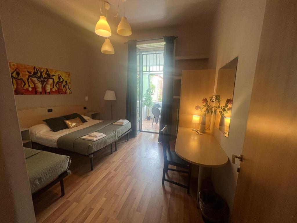 a bedroom with a bed and a table in it at Ambra Boutique Hotel in Milan