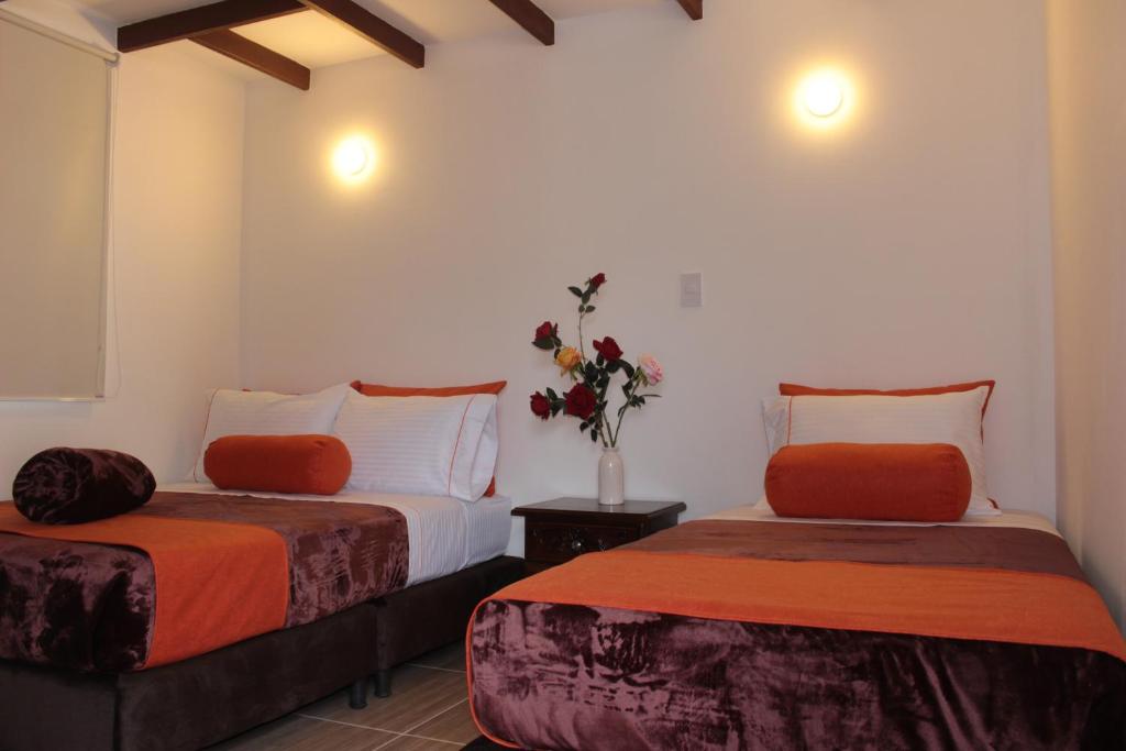 Postel nebo postele na pokoji v ubytování Hotel Campestre Sueño del Abuelo