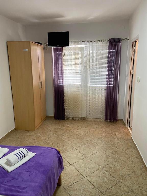 Postel nebo postele na pokoji v ubytování Apartmani Resetar