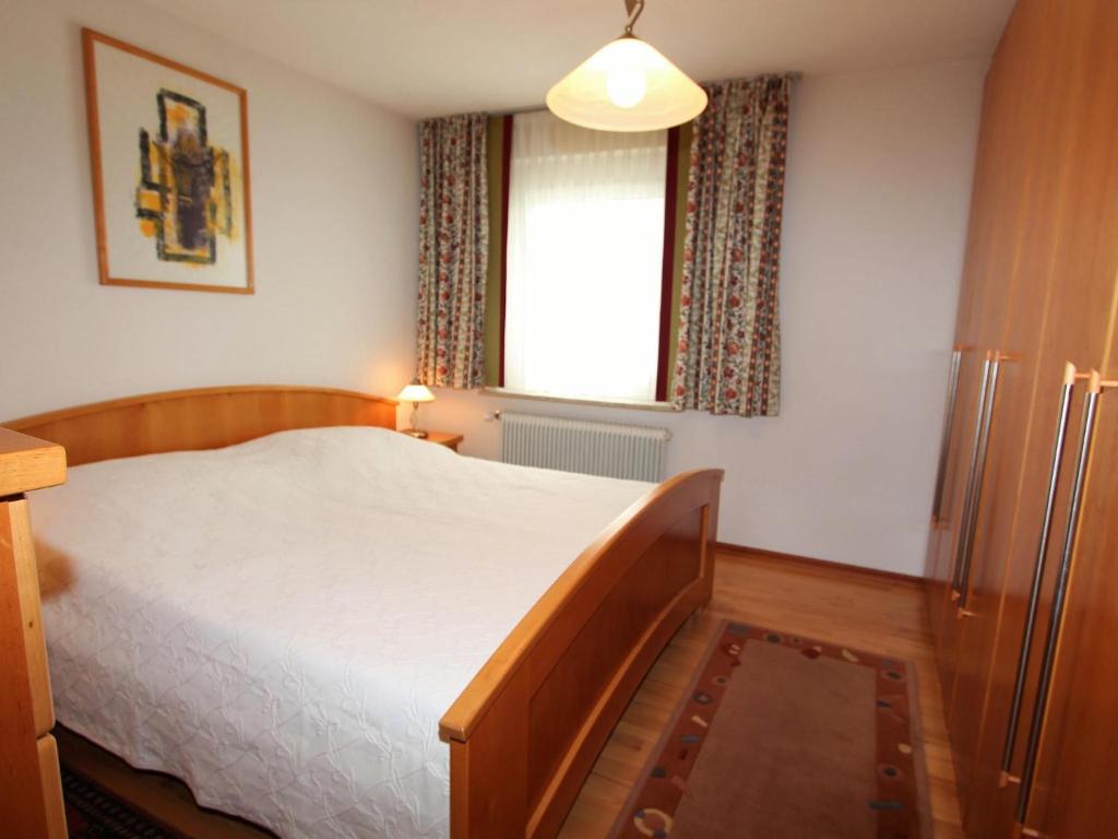 Postel nebo postele na pokoji v ubytování Mangartblick