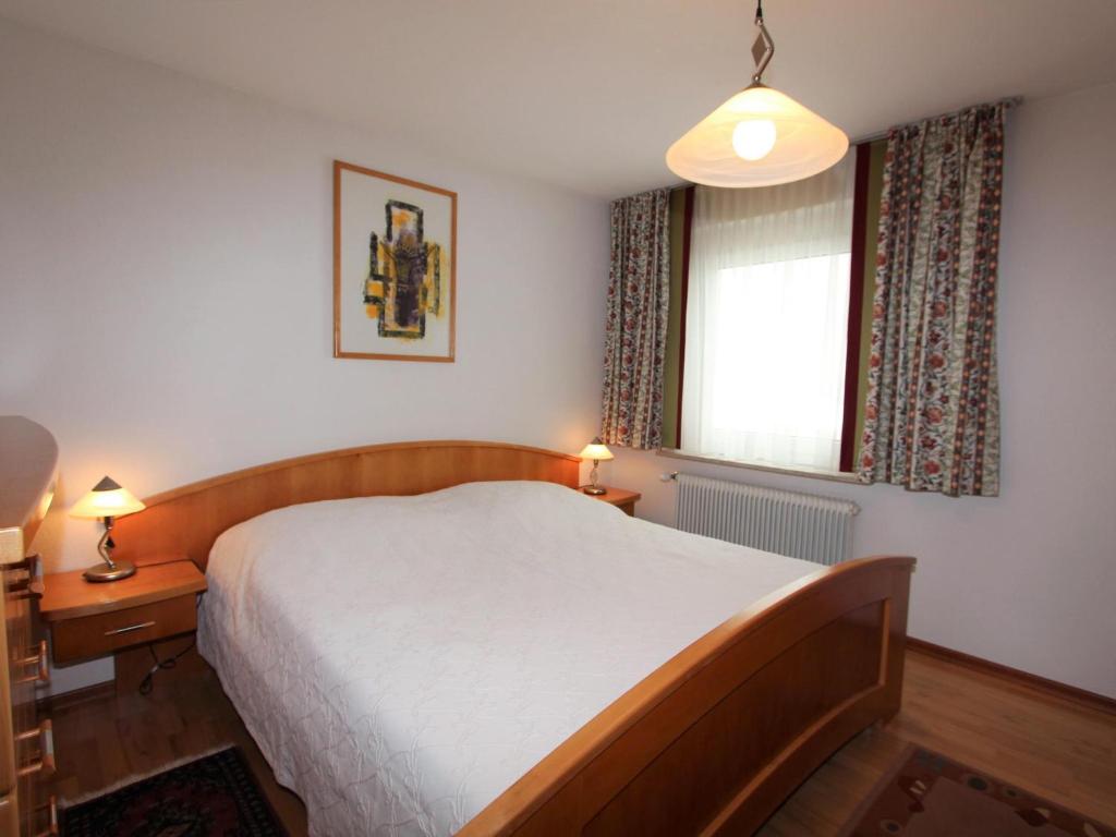 Postel nebo postele na pokoji v ubytování Mangartblick