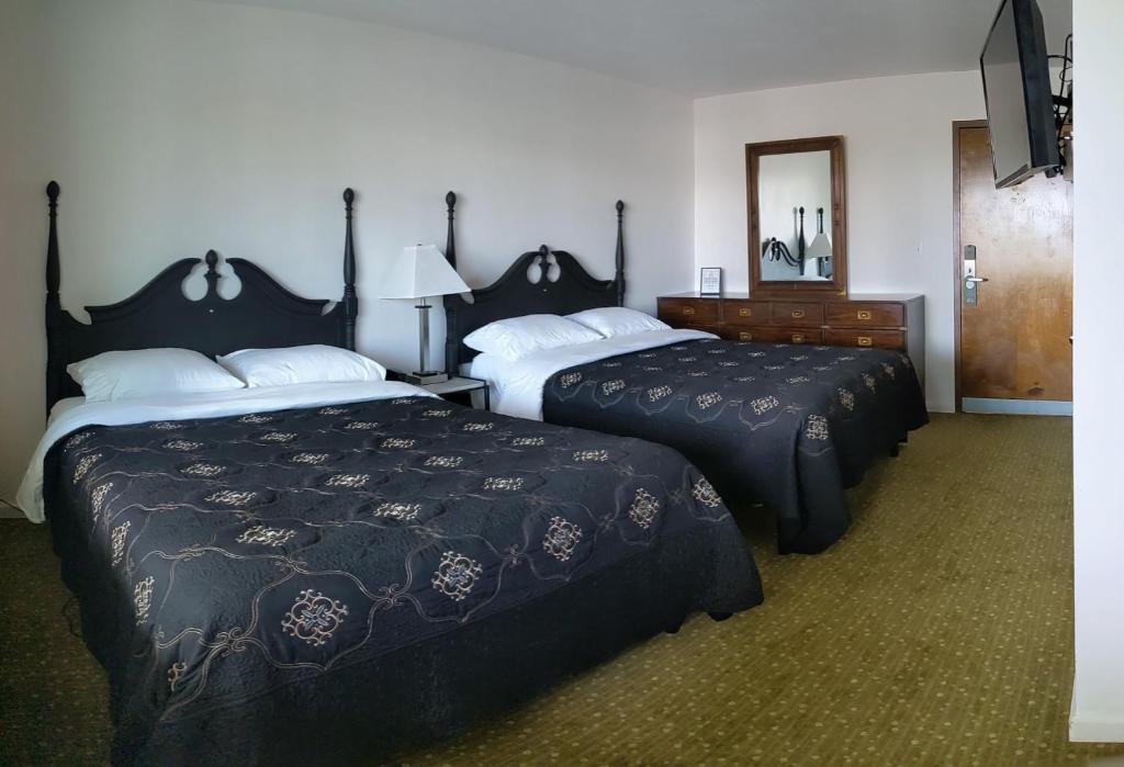 Postel nebo postele na pokoji v ubytování South Side Inn - Burlington