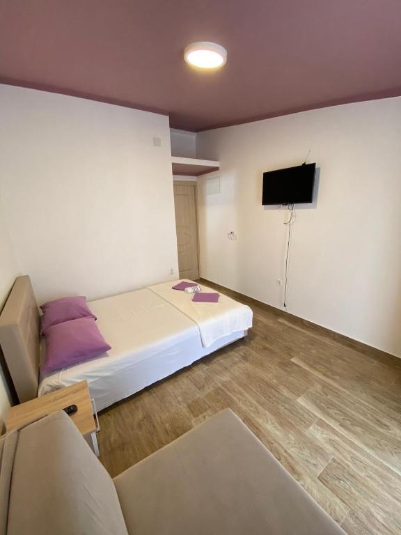 Postel nebo postele na pokoji v ubytování Apartmani Resetar