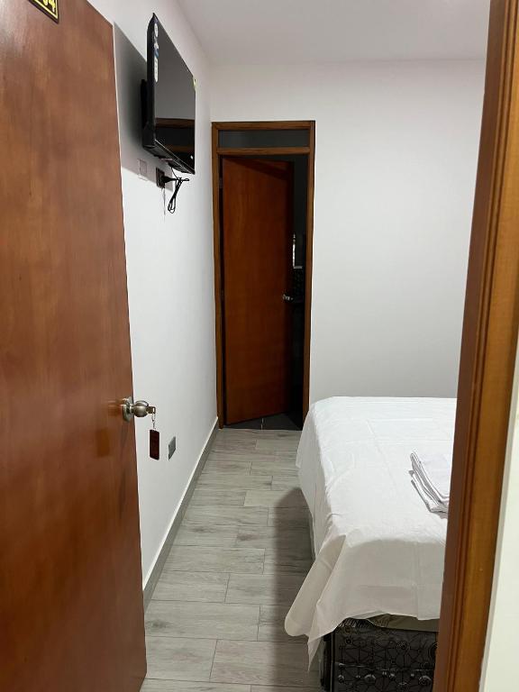 Postel nebo postele na pokoji v ubytování Hospedaje Limatambo