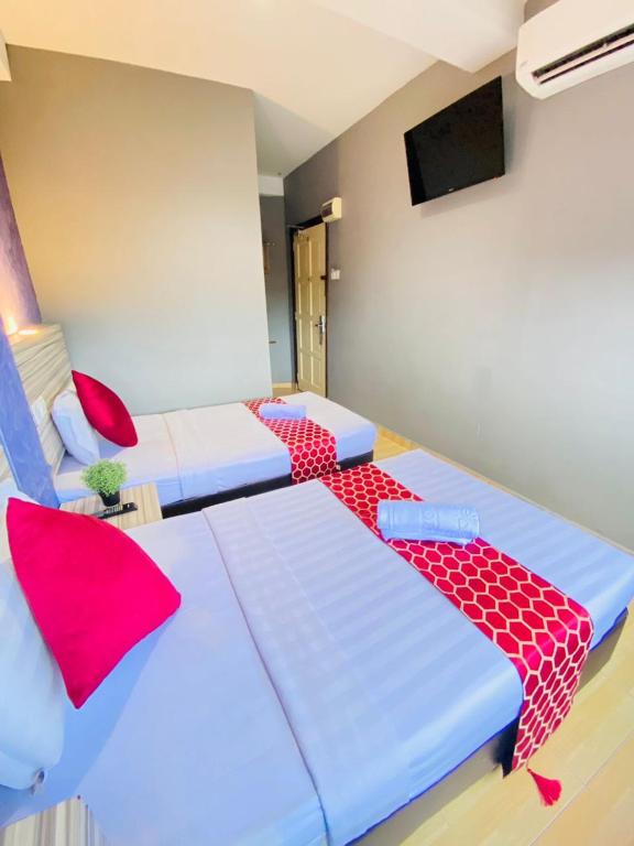 Postel nebo postele na pokoji v ubytování DJ Citi Inn Premier