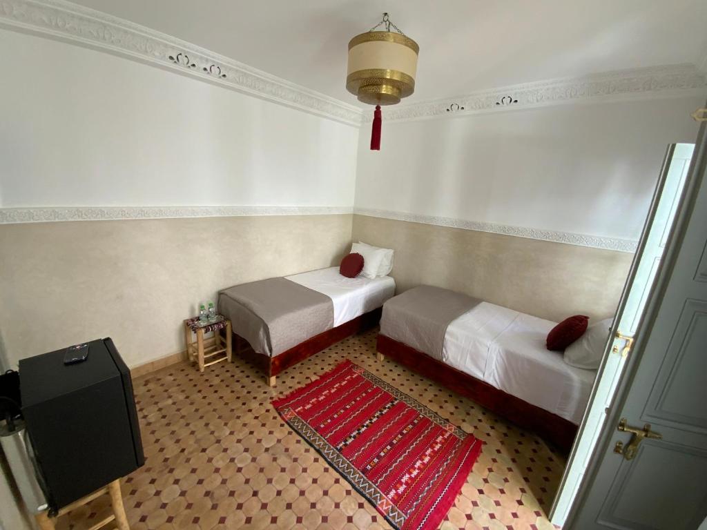 Postel nebo postele na pokoji v ubytování Riad Magnolia&SPA