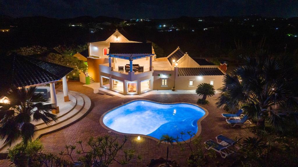 an aerial view of a house with a swimming pool at Wilderness Retreat-arubas Biggest Nature Hideaway in Santa Cruz