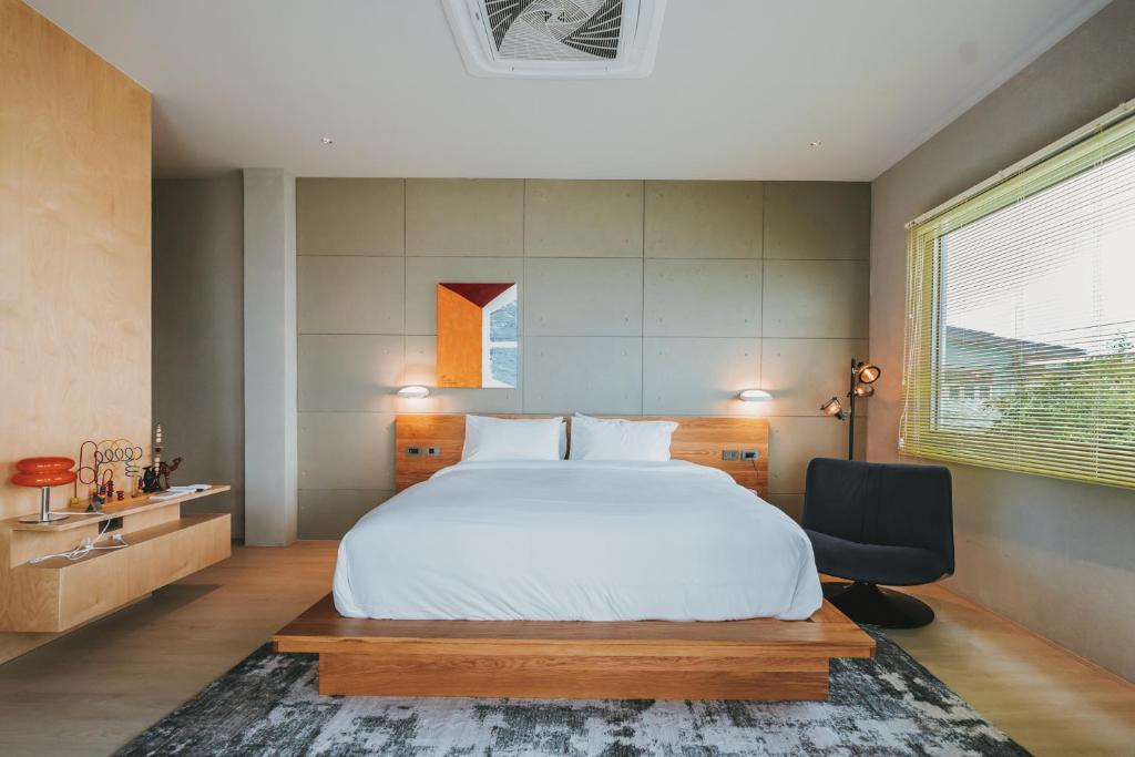 Postel nebo postele na pokoji v ubytování Arthit Resort Koh larn