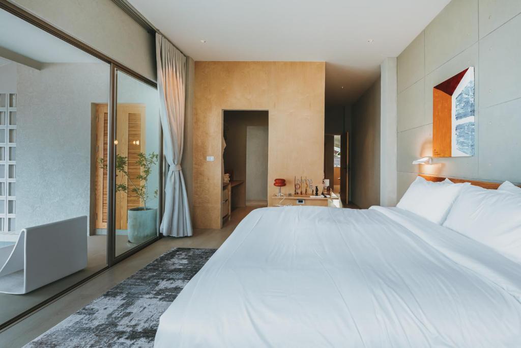 Postel nebo postele na pokoji v ubytování Arthit Resort Koh larn