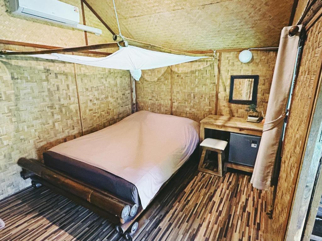 Postel nebo postele na pokoji v ubytování Pai Country Hut