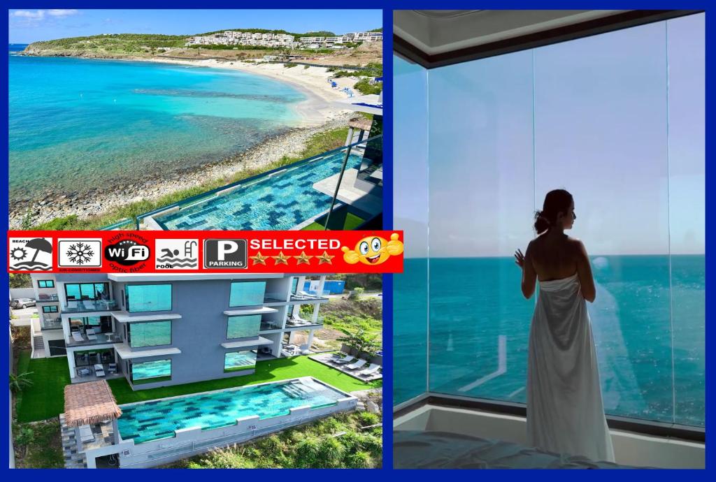 a woman looking out at the ocean from a building at condostmaarten by the sea in Koolbaai