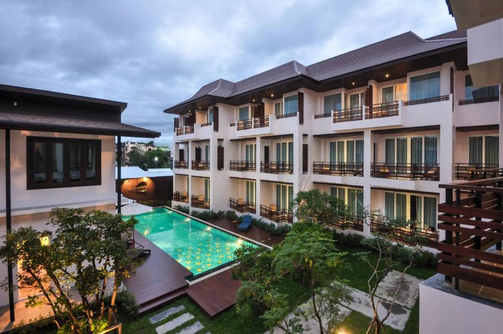 an aerial view of a hotel with a swimming pool at Le Patta Hotel Chiang Rai SHA Extra Plus in Chiang Rai
