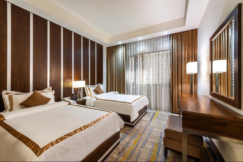 Cama o camas de una habitación en Sulaf Luxury Hotel