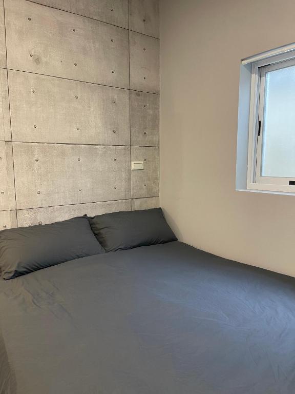 Letto o letti in una camera di Seagather海遇旅宿
