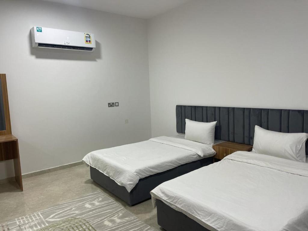 Postel nebo postele na pokoji v ubytování Haima Hotel