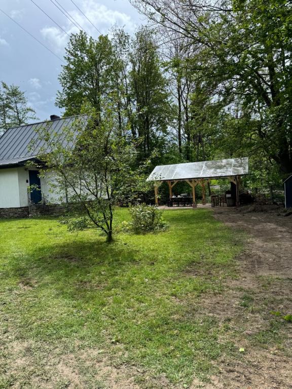 a house with a pavilion in a yard at Zdzisiówka in Walim