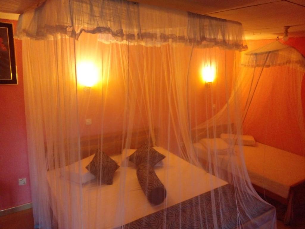 Postel nebo postele na pokoji v ubytování Omi Relax Inn