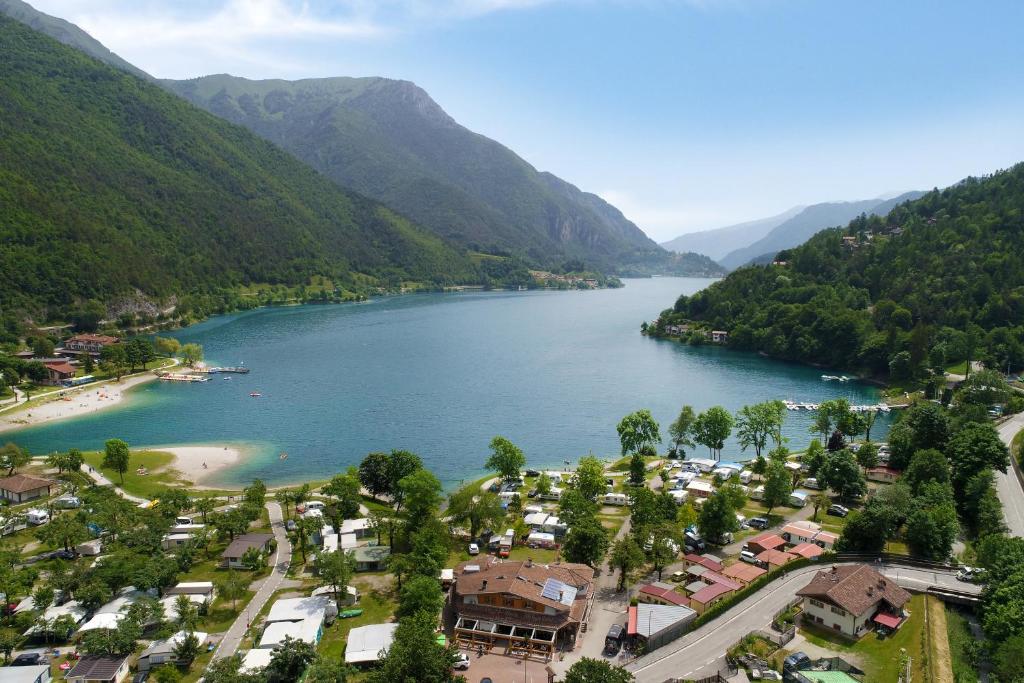 an aerial view of a town next to a lake at Camping Al Lago Ledro in Ledro