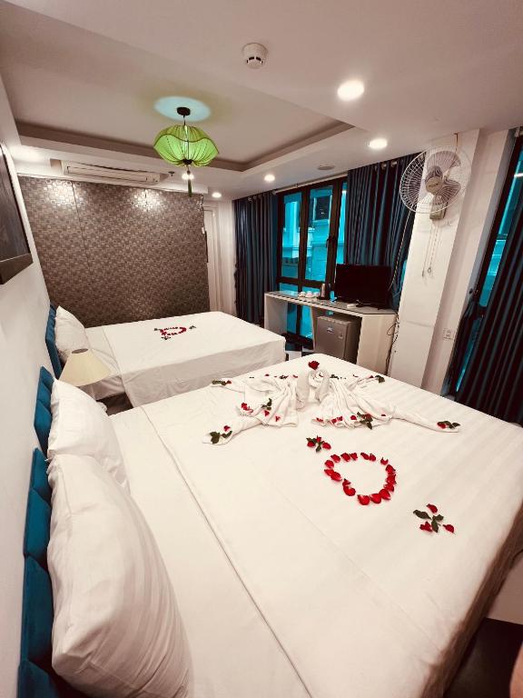 Postel nebo postele na pokoji v ubytování Hanoi Prime Garden Hotel & Spa