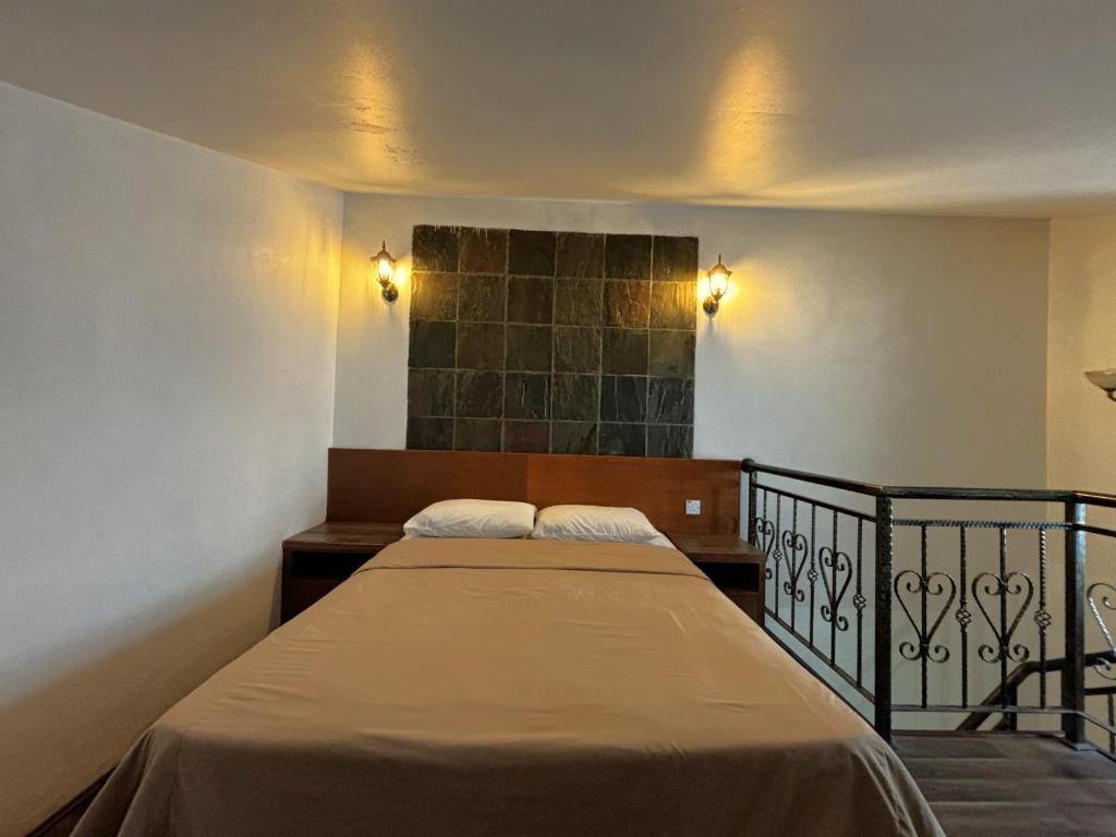 Postel nebo postele na pokoji v ubytování Cool Point Hotel