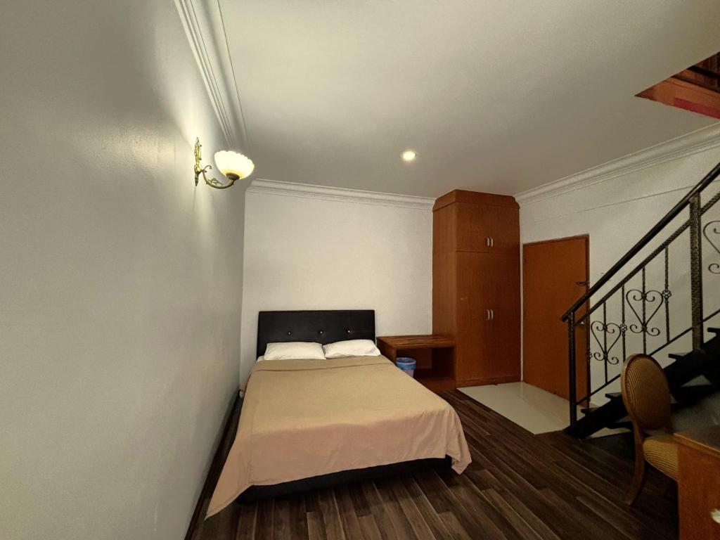 Postel nebo postele na pokoji v ubytování Cool Point Hotel