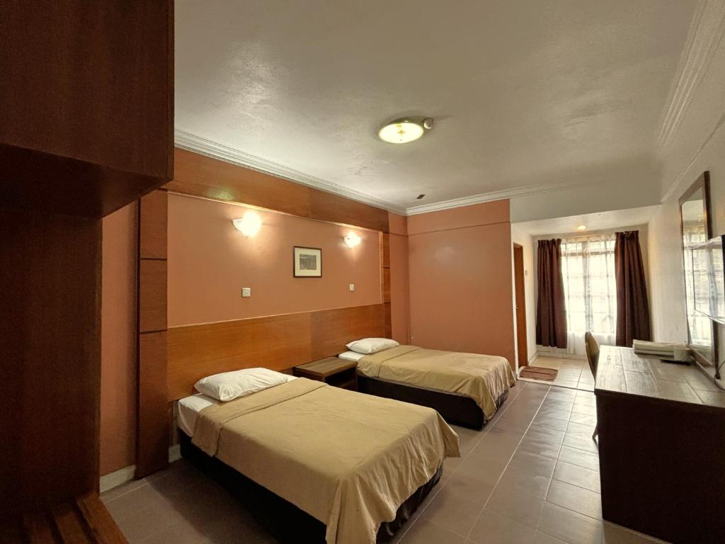 Postel nebo postele na pokoji v ubytování Cool Point Hotel