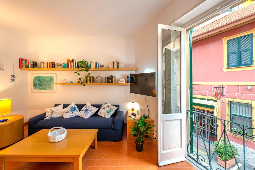 a living room with a couch and a table at StarFish in Santa Margherita Ligure
