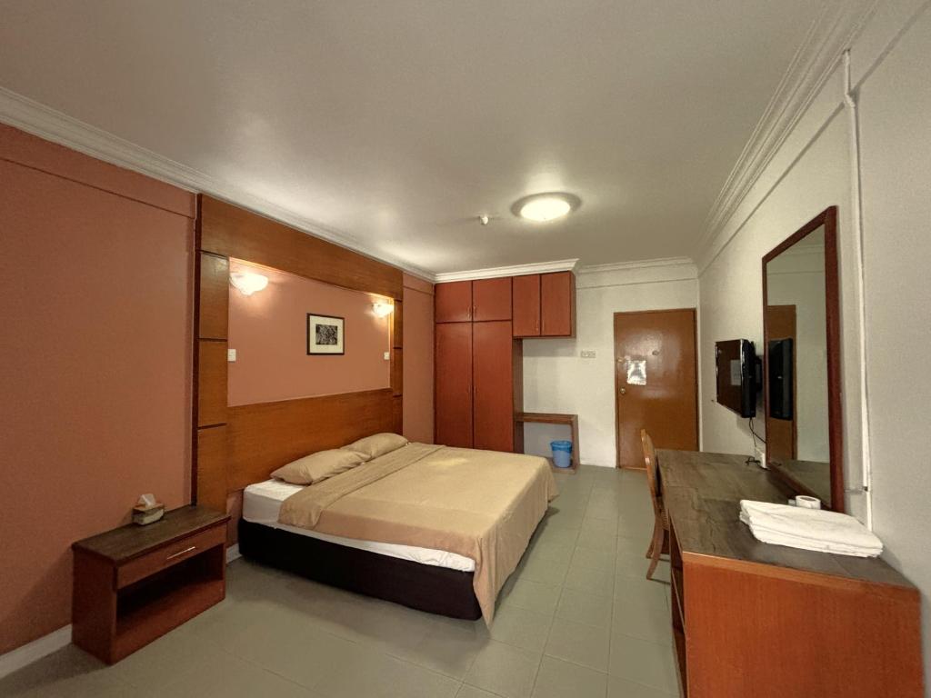 Postel nebo postele na pokoji v ubytování Cool Point Hotel